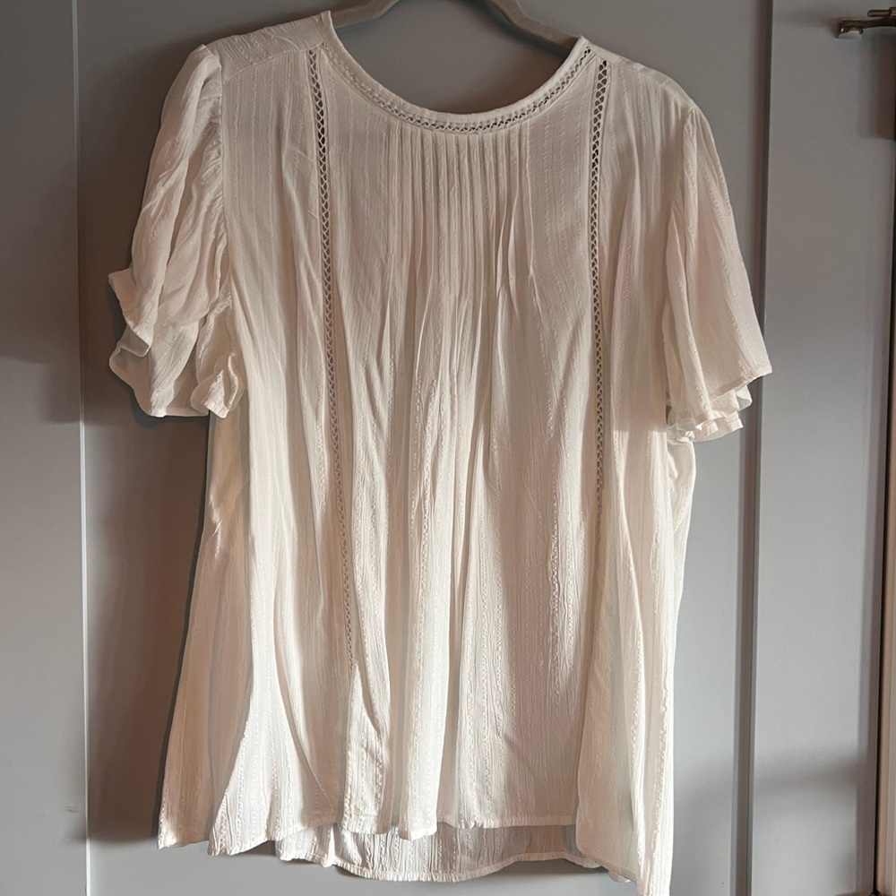 White blouse with hole design detail